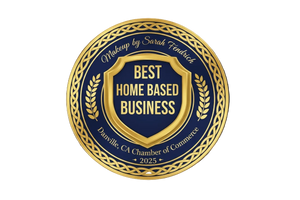 Gold and blue emblem for 'Best Home Based Business' award on a black background