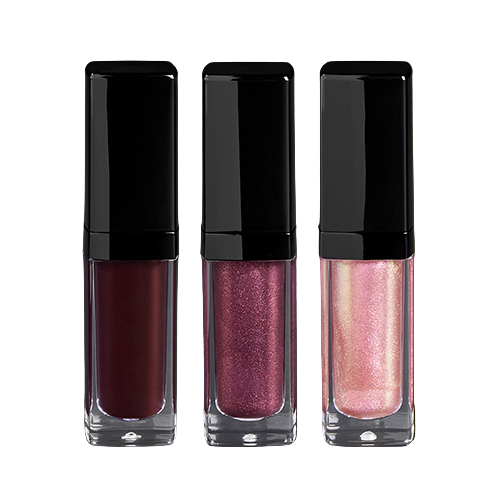 Three lip glosses with black caps on a reflective surface 